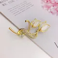 Detailed close-up of an elegant gold tulip brooch with white cat-eye stones and rhinestones - Gorgeous Round Diamond (A10-112)