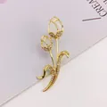 Elegant gold-tone tulip brooch with cat's eye stone and crystal inlay details - Elegant Double Flower (A10-111)