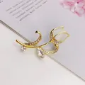 Elegant gold tulip brooch with white cat's eye stone and sparkling rhinestones - Exquisite Floral Style (A10-114)