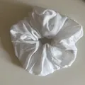 Close-up of a white large scrunchie with colorful confetti speckles fabric detail - White Scrunchie