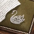 Sparkling silver swan brooch with clear crystals, elegant vintage accessory for clothing - Single Swan Style (A15-111) / Silver