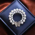 Elegant Korean style circular pearl brooch featuring a sparkling rhinestone butterfly. - Butterfly Circle Style (A16-117)