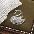 Elegant silver swan shaped brooch with sparkling clear rhinestones for women's fashion - Single Swan Style (A15-109)