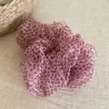 Detailed close-up showing the soft mesh fabric and pink leopard heart pattern of the scrunchie - Scrunchie / Pink Leopard