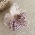 Close-up detail of a dual-texture mesh scrunchie with leopard print and cream organza. - Color-blocked Scrunchie / Pink Leopard Patch