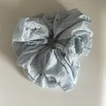 Macro view of a light blue chiffon scrunchie featuring an elegant white daisy floral print - 3# Large Style