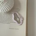 Detail shot of pink checkered wavy hair clip on vintage book page background. - Cloud Shape (8#)