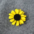 Close-up detail of a vibrant yellow sunflower brooch on a textured grey background - Yellow Sunflower Style (A21-97)