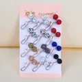 Detailed view of colorful U-shaped rhinestone scarf pins displayed on a card holder - Rhinestone Ball Style / Set of 12