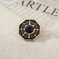 Vintage gold octagonal lapel pin with dark blue gemstone and black enamel ornate detail - Deep Blue Stone Octagon Style (A22-33)