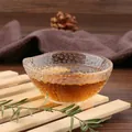 Detailed view of handcrafted hammered texture on a clear glass Kung Fu tea cup - Style 30 (KB001)