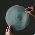 Elegant frosted glass salad bowl with teal ink swirl pattern and wavy edges. - Frosted Ink Wash / Blue