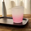 Elegant pink frosted glass Gongdao tea pitcher on a dark wooden tray for ceremonies - Pink Gradient Fair Cup