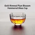 Hand-blown hammered glass teacup featuring elegant gold rim and plum blossom shape - Gold Rim Plum Blossom Hammered Cup