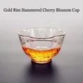 Elegant hand-blown glass tea cup with gold rim and hammered texture for Kung Fu tea ceremony - Gold Rim Cherry Blossom Hammered Cup