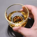 Handmade Japanese gold-rimmed glass tea cup with unique golden mountain base design - Gold Rim and Base