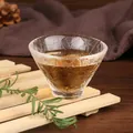 Elegant Japanese style hammered glass tea cup with textured surface on wooden coaster - Style 25 (KB001)