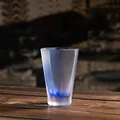 Elegant modern frosted octagonal glass tea cup featuring a unique blue ribbon base design - Octagonal Frosted Fragrance Cup / Glaze Blue