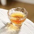 Irregular hammered glass teacup with textured ice-crackle finish for tea or sake - Single Cup / Clear