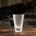 Frosted glass tea cup with embedded micro-bubble design and elegant tapered shape - Bubble Glass