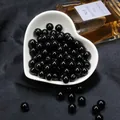 Perles rondes en acrylique noir brillant dans un bol en forme de cœur pour bijoux - Noir