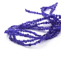Close-up of vibrant blue millefiori glass flower beads for DIY jewelry making craft - 45 Pieces/Pack / Sapphire Blue