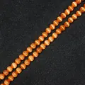 Perle tonde in pietra occhio di gatto arancione vibrante con effetto occhio di gatto - Arancione