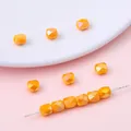 Oranje gefacetteerde tonvormige glaskristallen kralen voor DIY-armbanden en sieraden - Set van 20 Stuks / 5x6mm (Gat 1mm) / Porselein Geel AB
