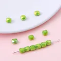 Lichtgroene gefacetteerde kristallen glazen vatkralen voor DIY handgemaakte sieraden - Set van 20 Stuks / 5x6mm (Gat 1mm) / Grasgroen AB