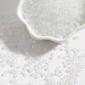 Perles de rocaille irisées blanches de 4 mm dans un bol en céramique pour la création de bijoux - Env. 2mm, 15g/Paquet, Env. 1000 pièces / Blanc AB
