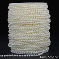 Detail view of 4mm cream white ABS imitation pearl chain on a spool, 5m length - Round Style / 4mm 5m Pack / Beige