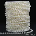 Detailed macro shot of 5mm cream white ABS faux pearl bead chain on a white spool - Round Style / 5mm 5m Pack / Beige