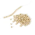 Primer plano de cuentas geométricas facetadas de CCB dorado para creación de joyas DIY - Cuentas de Columna Facetadas / 3x3mm 500 Piezas/Paquete / Oro KC