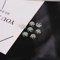 Sette cappucci per perline a fiore in filigrana d'argento su sfondo bianco e nero per DIY - 10mm (100 Pezzi) / Argento