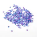 Close-up showing the iridescent blue and purple gradient on flatback ABS imitation pearls - Diameter 3mm (Approx 1000 Pieces/Pack) / Iridescent - Lake Blue Purple Red