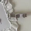 Detailed macro view of a metallic silver leather bow hair clip with textured finish. - Small Bow Hair Clip / 3# / Silver
