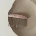 Detailed view of a pink polka-dot fabric hair comb accessory with metallic teeth - Pink Oval Black Polka Dot Hair Comb (3#)