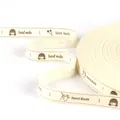 Cream colored cotton ribbon roll with Hand Made text print, 1.5cm wide for DIY craft accessories - Handmade Girl and Sewing Tools Style (Style 14)