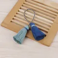 Vue détaillée de glands en coton faits main avec une boucle tressée et couleurs bleues. - Gland à Double Extrémité / Vieux Vert + Bleu Marine