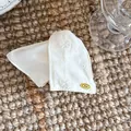 Macro view of white satin hair accessory featuring delicate floral embroidery details - 1# Off-White Triangle Hair Claw
