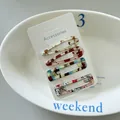 Detailed macro shot of four colorful patterned snap hair clips on a white display card - 2# (Cartoon Animal)