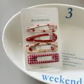 Detailed view of four colorful polka dot and plaid hair clips set on a display card. - 8# (Fruit Strawberry)