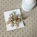 Floral fabric bow hair clip with beige resin beads on display card - Floral Beads Style (12#)