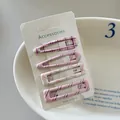 Detail view of 4-piece set plaid and striped hair clips on a white display card. - 16# (Pink Purple Plaid)