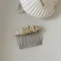 Close-up detail of a cream floral fabric hair comb accessory with silver metal tines - 2# Off-White Green Flower Pleated Oval Hair Comb