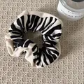 Zebra pattern knit scrunchie with cream trim hair accessory in lifestyle setting - White Edge Black White Striped (8#)