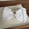 Elegant floral print fabric bow hair claw clip with central pearl and crystal accent - Pink Floral Bow Claw
