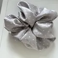 A detailed macro shot of a shiny silver-gray satin scrunchie featuring white polka dots - Basic Scrunchie / Gray White Polka Dot