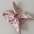 Close-up detail of a pink satin polka dot scrunchie showcasing its soft silk-like texture. - Scarf Style Scrunchie / Pink White Polka Dot