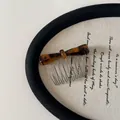 Close-up of tortoise shell acetate bow on a metal hair side comb for women - Hair Comb / Dark Leopard Bow Hair Comb